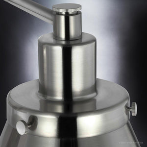 A unique lighting fixture, the UHP3310 Traditional Wall Light from the Pawtucket Collection by Urban Ambiance, showcases a brushed nickel finish on a black background.