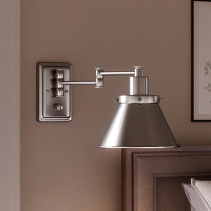 A luxury bedroom with a bed and an Urban Ambiance Pawtucket Collection bedside lamp.