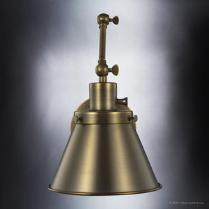 An UHP3322 Traditional Wall Light from the Pawtucket Collection, with an Olde Brass Finish, on a dark background, in a beautiful lighting fixture.