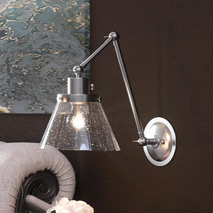 A unique bed with a UHP3330 Traditional Wall Light, 14.375"H x 8"W, Brushed Nickel Finish, from the Pawtucket Collection by Urban Ambiance and a
