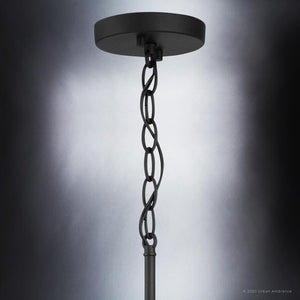 A Modern Farmhouse Pendant Light from the Southfield Collection, with a beautiful midnight black finish and a chain hanging from it.