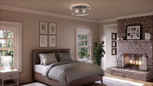 A luxurious bedroom with a UHP3391 Provincial Ceiling Light and a fireplace.