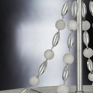A beautiful UHP3400 Provincial chandelier with white beads hanging from it.