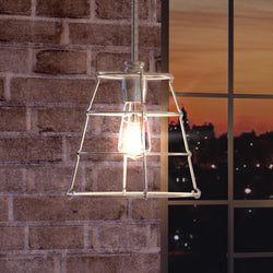 A Beautiful pendant lamp hanging from a brick wall.