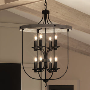 A gorgeous French Country chandelier from the Adelaide Collection, with a charcoal finish, hanging in a room.