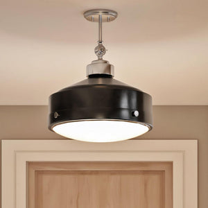 A luxury ceiling lamp hanging above a wooden door.