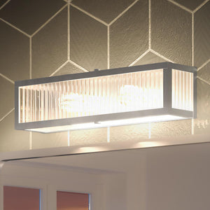 An image of a bathroom with the gorgeous UHP3580 Minimalist Bath Vanity Light lighting fixture from the Bismarck Collection by Urban Ambiance above it.