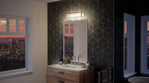 An urban bathroom with a gorgeous view of the city.