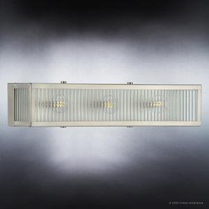 A unique lighting fixture from the Bismarck Collection featuring a stainless steel finish and three glass panels.