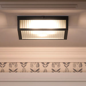 A beautiful UHP3611 Minimalist Ceiling Lamp, 4"H x 11"W, Midnight Black Finish, Bismarck Collection with a floral pattern on it.
