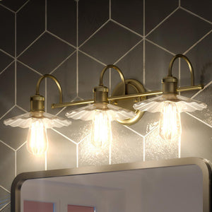 An Urban Ambiance bathroom with three UHP3681 Vintage Bath Vanity Lights and a mirror.