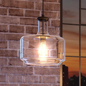 An Industrial Chic Pendant lamp, hanging from a brick wall.