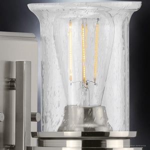 A beautiful lighting fixture with a brushed nickel finish from the Missoula Collection, featuring a glass shade and included light bulb.