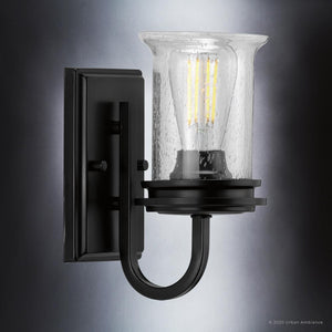 An UHP3741 French Country Bath Vanity Light with a clear glass shade from the Urban Ambiance Missoula Collection.