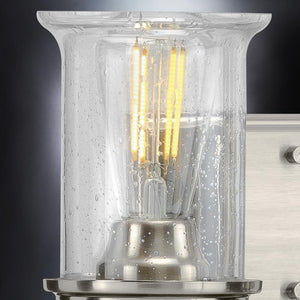 A beautiful French Country Bath Vanity Light with a brushed nickel finish and clear glass bulb.