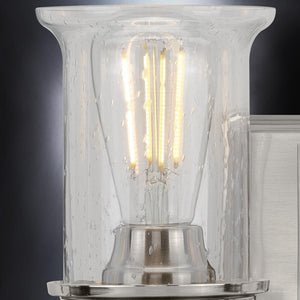 A gorgeous vanity lighting fixture from the Missoula Collection by Urban Ambiance, featuring a brushed nickel finish and glass shade.