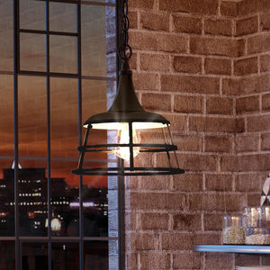 A unique lighting fixture hanging from a brick wall.