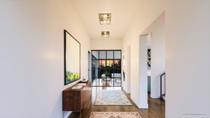 A luxurious hallway with a UHP4031 Modern Ceiling Light 4.5''H x 12''W, Satin Gold Finish, Singleton Collection by Urban Ambiance wooden floor and a gorgeous