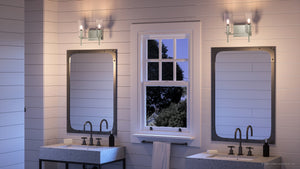 A luxurious Urban Ambiance bathroom with two sinks and a window featuring elegant lighting fixtures.