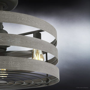 Close-up of the Urban Ambiance UHP9031 Modern Farmhouse Indoor Ceiling Fan from the Adelaide Collection, featuring charcoal gray, wood-textured metal bands and exposed bulbs, set against a gradient background for a rustic industrial aesthetic.