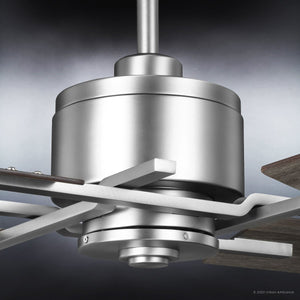 Close-up of the Urban Ambiance UHP9061 Urban Loft Indoor Ceiling Fan motor in aged nickel, featuring reversible wooden blades from the Amelia Collection, photographed against a gradient background.