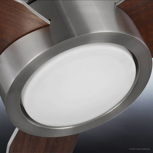Close-up of the Urban Ambiance UHP9070 Modern Indoor Ceiling Fan from the Camden Collection, featuring a brushed nickel housing, wooden blades, and an integrated LED light set in a circular frosted center; measures 9.9 inches high by 56 inches wide.