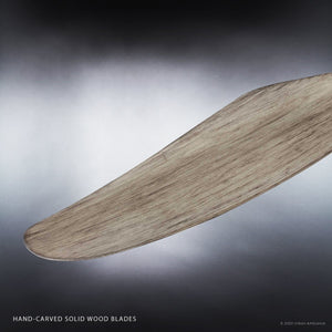 Close-up of a single curved, hand-carved solid wood blade from the Urban Ambiance UHP9090 Modern Indoor Ceiling Fan (15.5″H x 60″W, Charcoal, Lewes Collection), set against a neutral gradient background.