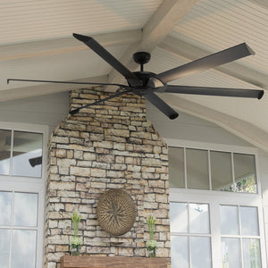 An Urban Ambiance UHP9131 Industrial Indoor or Outdoor Ceiling Fan, 15.5"H x 96"W, Midnight Black, Key West Collection with a stone fireplace.