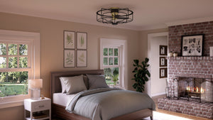 A bedroom with a UHP9150 Luxe Indoor Ceiling Fan and a fireplace, featuring gorgeous lighting fixtures.
