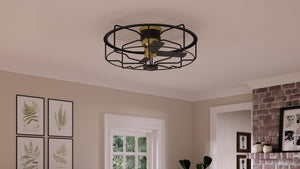 A living room with a unique lighting fixture, the UHP9150 Luxe Indoor Ceiling Fan from the Harwich Collection by Urban Ambiance.