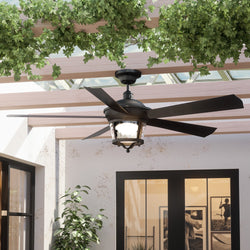 An UHP9181 Modern Farmhouse Indoor or Outdoor Ceiling Fan, 19.5"H x 52"W, Black Iron, Catalina Collection by Urban Ambiance in a patio with potted plants.