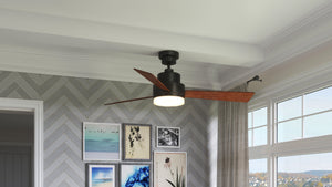 A UHP9211 Modern Indoor Ceiling Fan in Olde Bronze from the Capitola Collection by Urban Ambiance, creating a gorgeous atmosphere in a living room.