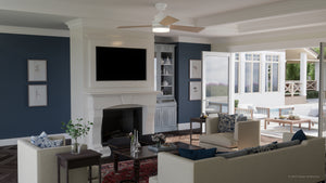 A modern living room features blue accent walls, a white fireplace, mounted TV, cream sofas, and glass coffee tables. Overhead, the Urban Ambiance UHP9212 Modern Indoor Ceiling Fan from the Capitola Collection (15.8″H x 52″W, White) offers energy-efficient comfort. Open doors lead to a sunlit patio with outdoor seating.