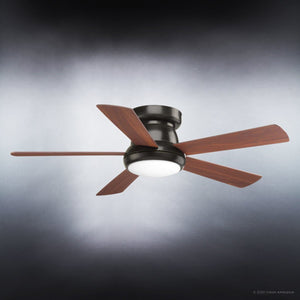 The Urban Ambiance UHP9230 Traditional Indoor Ceiling Fan from the Beaufort Collection features four American Walnut blades and a central LED light fixture, elegantly mounted on an Olde Bronze base and showcased against a neutral gradient background.