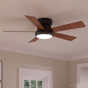 The Urban Ambiance UHP9230 Traditional Indoor Ceiling Fan from the Beaufort Collection features an Olde Bronze finish and four American Walnut blades, along with a central LED light fixture. It is shown mounted on a white ceiling in a neutral-colored room.