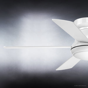 Close-up of the Urban Ambiance UHP9232 Traditional Indoor Ceiling Fan from the Beaufort Collection, showcasing its modern white finish, four blades, and an opal glass diffuser with integrated LED light. The 52-inch fan is partially cropped on the right side against a gradient gray background.