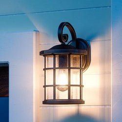 A luxury lighting fixture, UQL1041 Craftsman Outdoor Wall Light from the Vienna Collection by Urban Ambiance, with a lantern on it.