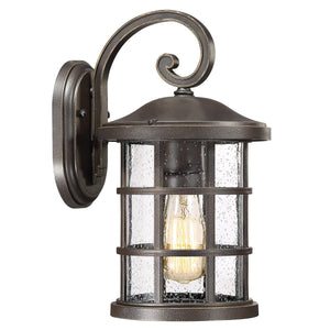 Urban Ambiance UQL1043 Craftsman Outdoor Wall Light from the Vienna Collection features a Parisian Bronze finish, clear seedy glass shade, and exposed bulb design, all elegantly mounted on a curved arm. Measuring 14.25″H x 8″W with marine-grade construction, this inviting fixture is the perfect addition to your outdoor space.