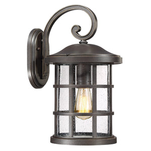 Illuminate your exterior with the Urban Ambiance UQL1045 Craftsman Outdoor Wall Light from the Vienna Collection, featuring a durable marine-grade metal frame in an elegant Parisian Bronze finish, clear seeded glass panels, and a decorative curved arm that highlights its timeless Craftsman-inspired design. Measures 17.75″H x 10″W.