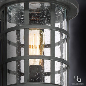 Close-up of the Urban Ambiance UQL1046 Craftsman Outdoor Post Light from the Vienna Collection, featuring a natural black finish and marine-grade construction, glowing through water-specked glass. Dimensions: 17.25