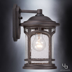 Elevate your home’s exterior with the Urban Ambiance UQL1101 Rustic Outdoor Wall Light from the Sydney Collection, featuring an 11″H x 7″W profile, a Parisian Bronze finish, durable marine-grade construction, and clear seeded glass panels that showcase the glowing bulb—an elegant and weather-resistant wall sconce for outdoor spaces.