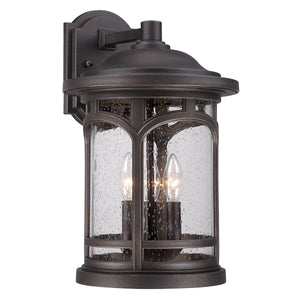 The Urban Ambiance UQL1105 Rustic Outdoor Wall Light from the Sydney Collection features a Parisian Bronze finish, clear seeded glass, and two candle-style bulbs on a rectangular backplate; it measures 17.75″ high by 11″ wide and offers marine-grade construction.