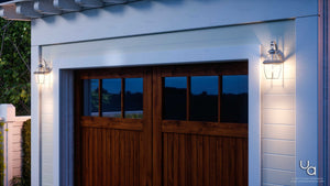 A beautiful garage door with the UQL1141 Colonial Outdoor Wall Light, 11.5
