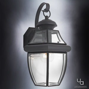 The Urban Ambiance UQL1142 Colonial Outdoor Wall Light from the Cambridge Collection features a black silk finish, beveled glass, and an elegant curved arm mounted on a rectangular backplate. Measuring 14 inches high by 8 inches wide, this Colonial-inspired fixture displays a single visible bulb inside, adding timeless charm to any exterior wall.