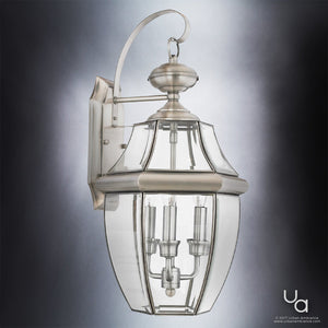 A gorgeous Colonial lighting fixture with a clear glass shade.