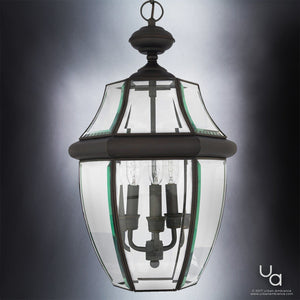 The Urban Ambiance UQL1159 Colonial Outdoor Pendant Light from the Cambridge Collection features a black silk finish and clear beveled glass in a lantern-style design with four candle-shaped bulbs, shown here against a grey gradient background.