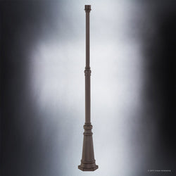 A beautiful image showcasing the unique Urban Ambiance UQL1191 Colonial Outdoor Post, adorned with a lamp, in a Royal Bronze Finish.