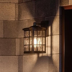 A unique and luxury lighting fixture, the UQL1233 Craftsman Outdoor Wall Light, 13"H x 8"W, in a Parisian Bronze Finish from the Zurich Collection by Urban Ambiance
