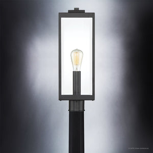 A gorgeous lighting fixture from the Urban Ambiance Quincy Collection, featuring a unique UQL1333 Farmhouse Outdoor Post/Pier Light with a light bulb on it.