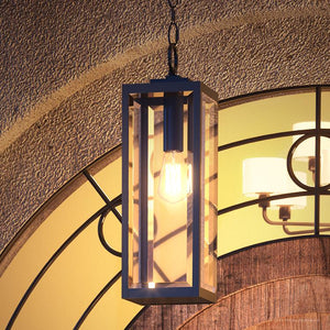 A gorgeous UQL1334 Farmhouse Outdoor Pendant Light, 20.75"H x 7"W, from the Quincy Collection hanging from a doorway (Brand Name: Urban Ambiance).